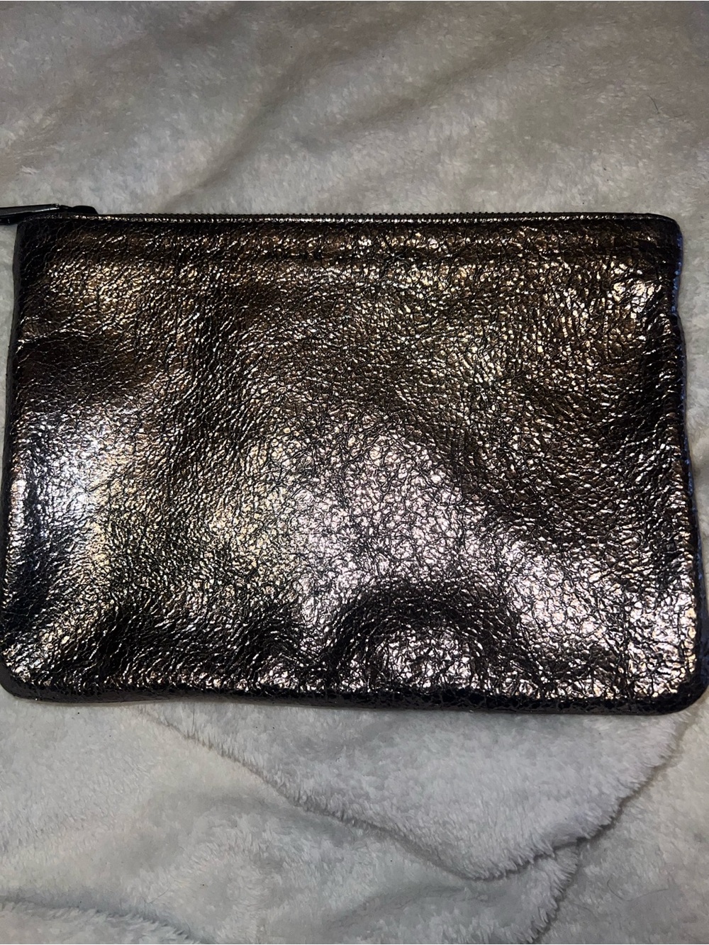 Marc Jacob’s metallic silver zipper pouch
